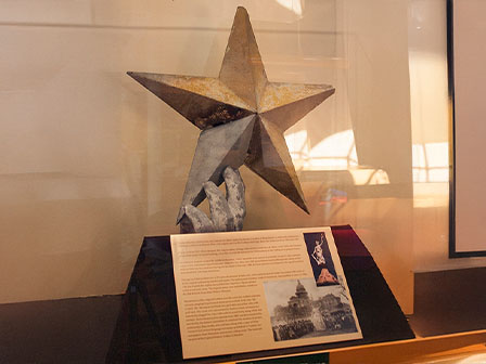 Row 9. Image 1994. close up of the Goddess of Liberty star on display at the CVC.